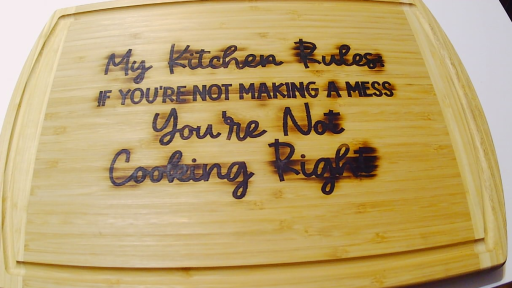 Cutting board with wood burned design and sealed with food safe oil.