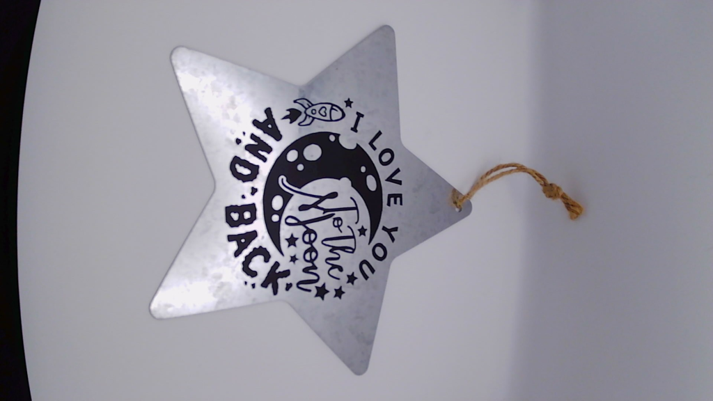 Metal sign with vinyl phrase.