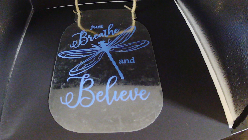 Metal sign with vinyl phrase.